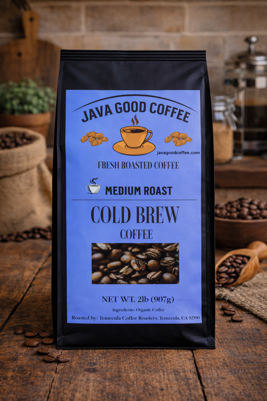 Java Good Coffee bag on a wooden surface with coffee beans and a coffee grinder in the background.