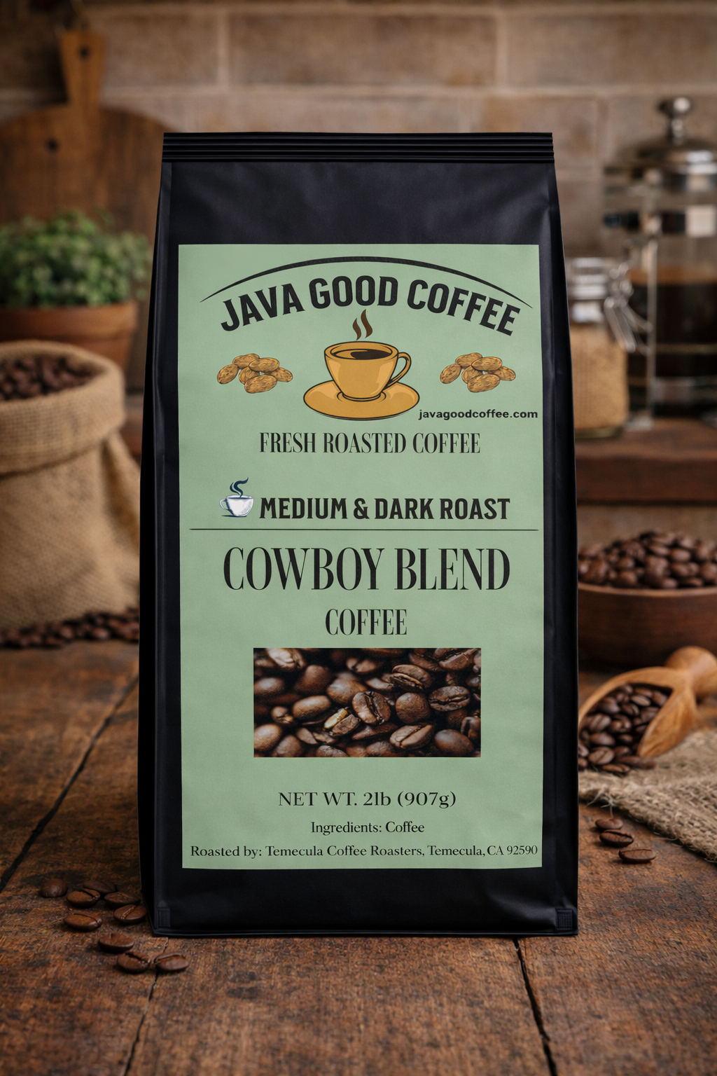 Java Good Coffee Cowboy Blend package on a wooden surface with coffee beans and a rustic background.