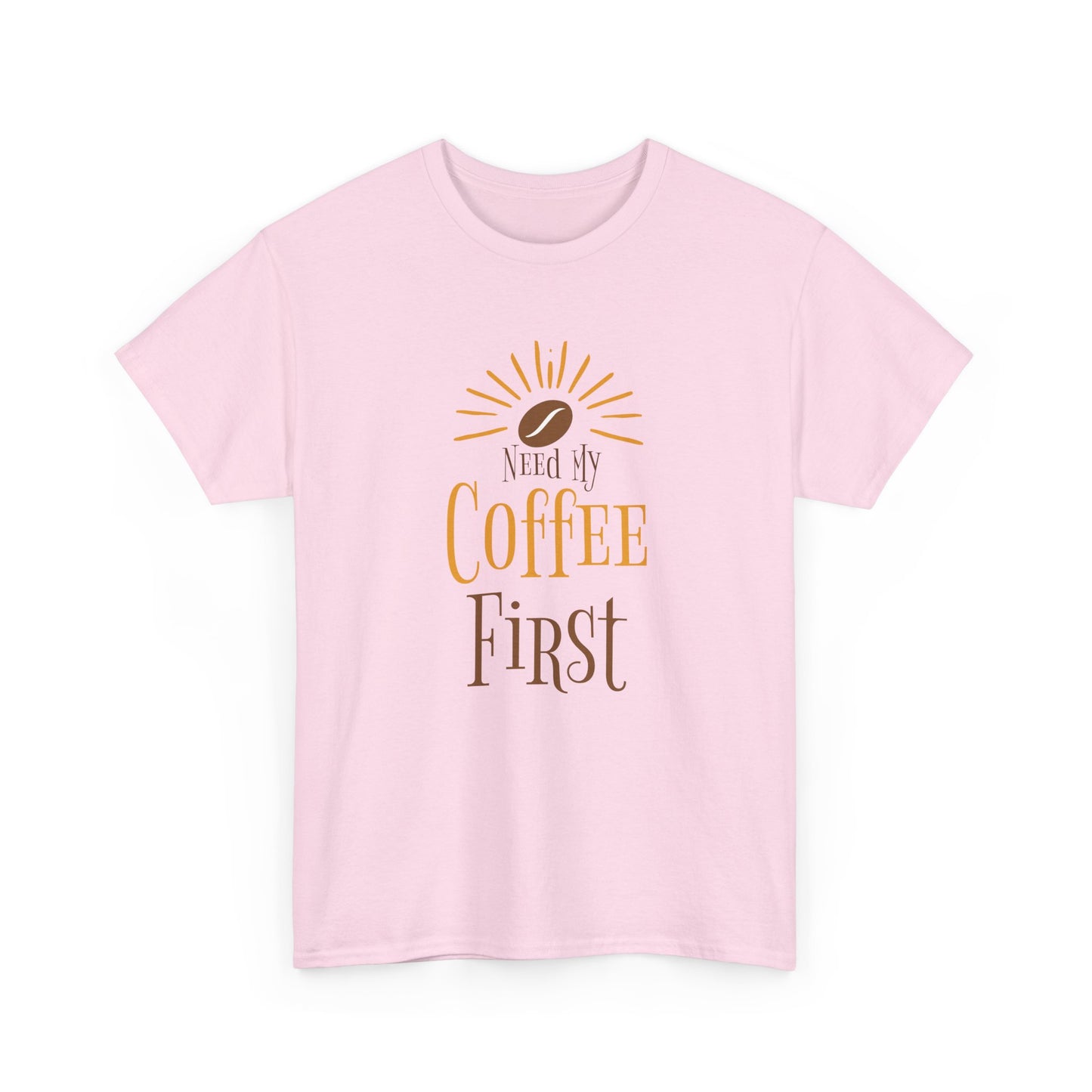Pink t-shirt with 'Need My Coffee First' text and coffee bean graphic on a white background