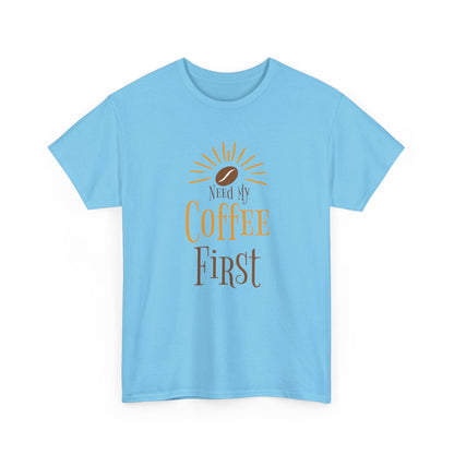 Light blue t-shirt with 'Need My Coffee First' text and sun graphic on a white background